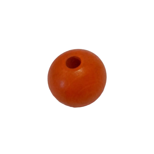 A large wooden orange spherical bead with a hole at the top,