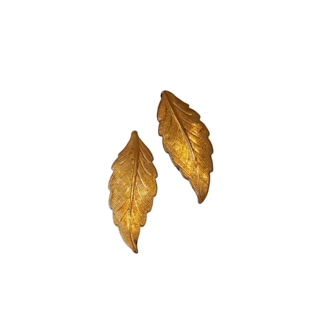 A pair of gold-toned leaf-shaped earrings with textured, ribbed surface for earrings and embellishments