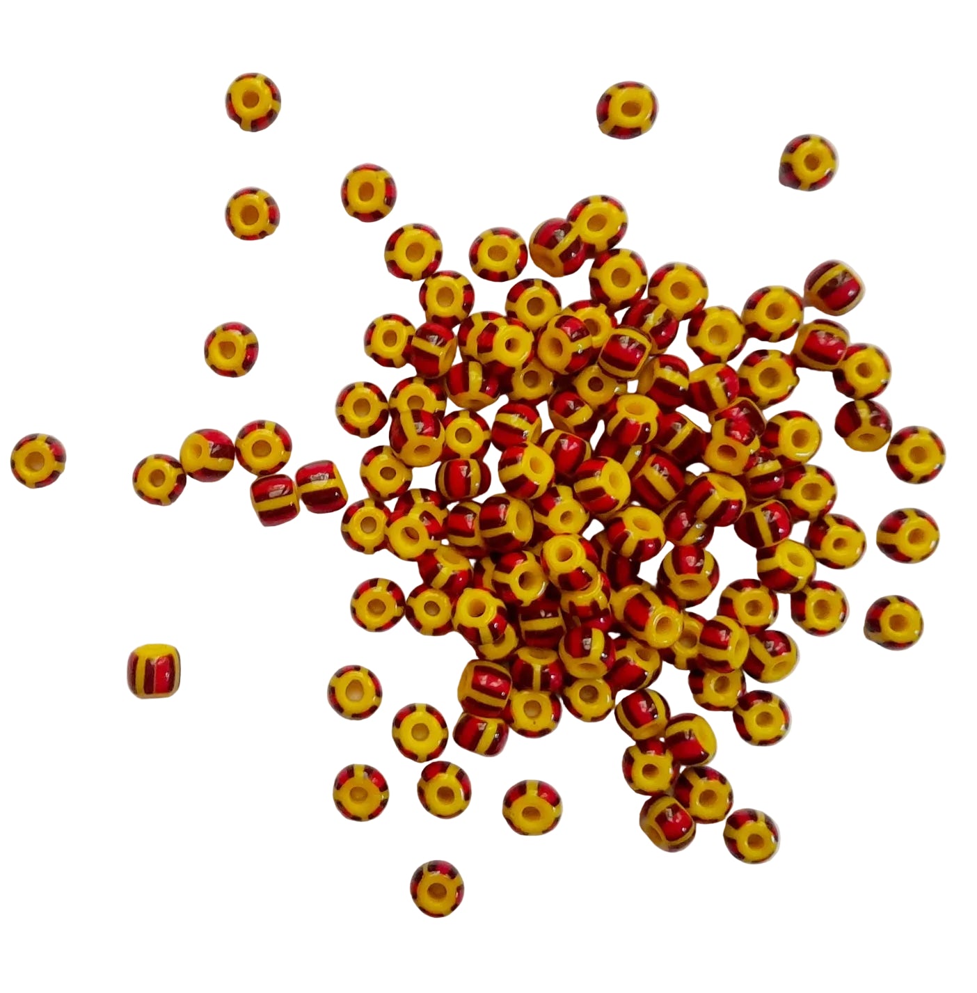 Yellow and red beads scattered on a white background