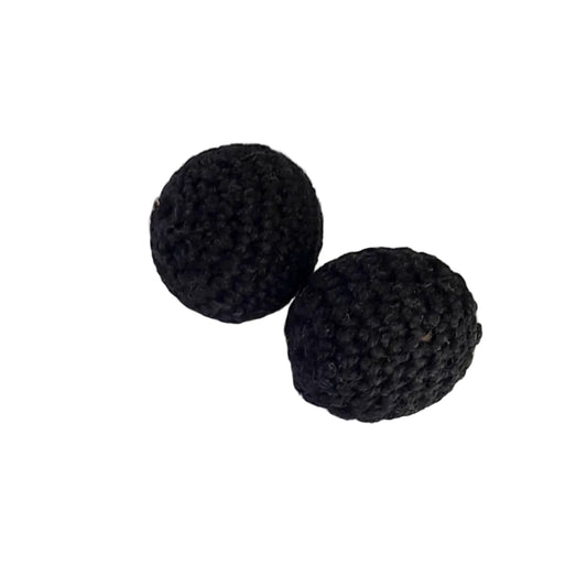 Two 25mm black crocheted or knitted round beads