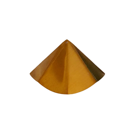 A small metallic gold pyramid-shaped object, 