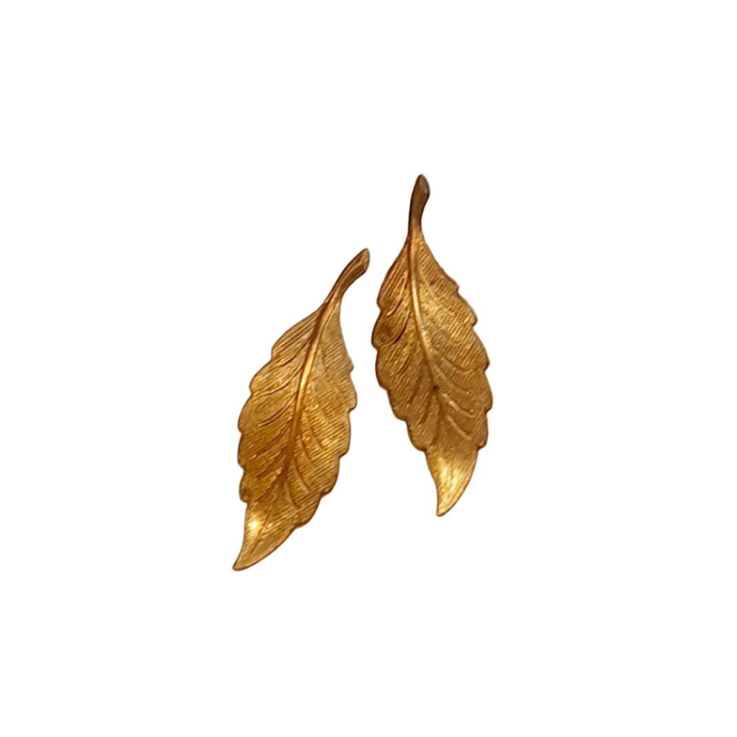 A pair of gold-toned leaf-shaped earrings with textured, ribbed detailing, 