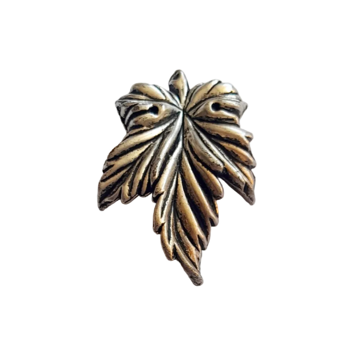 An antique silver-toned metal large chunky  leaf-shaped charm with detailed leaf veins, 