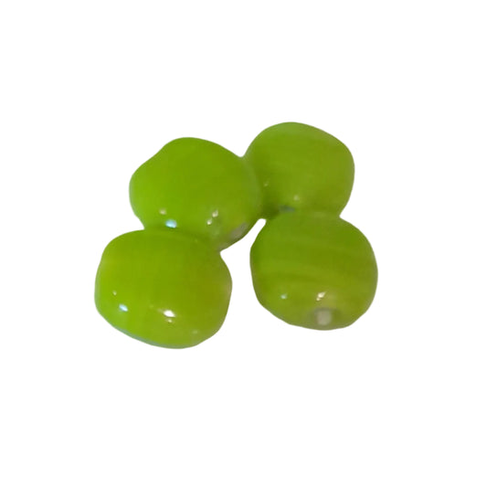 glossy lime green glass beads with a rounded, slightly flattened shape, indian glass