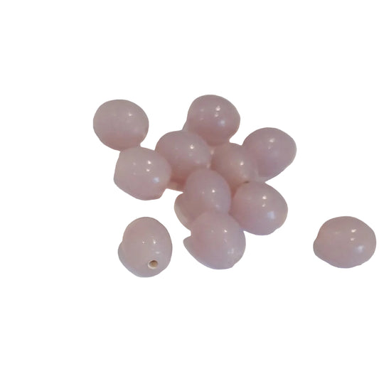small, smooth, oval-shaped beads in a soft dusty lilac indian glass
