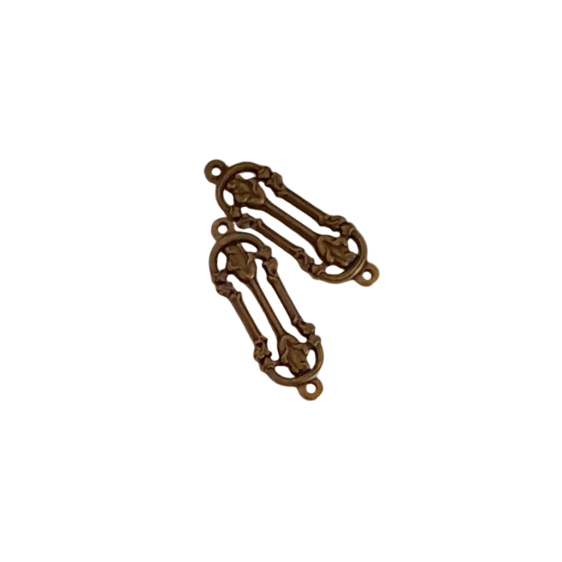 Two ornate antique bronze metal jewelry findings with decorative scrollwork and loops,