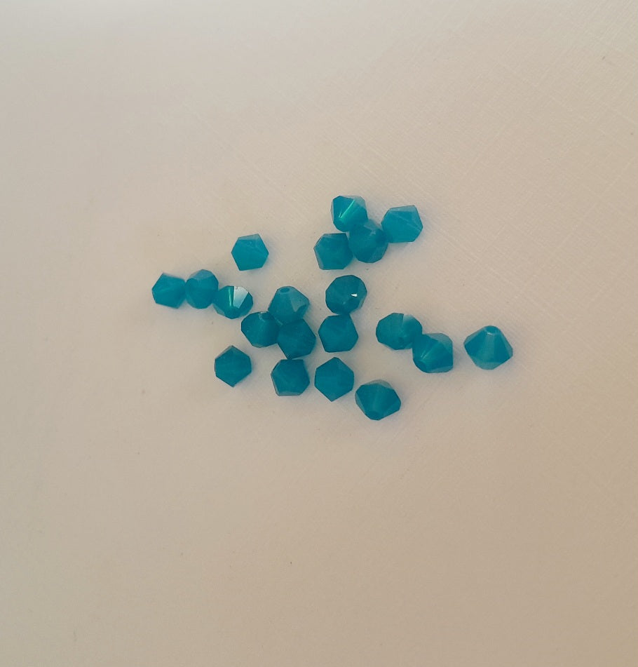 A small 4mm faceted teal-blue carabbean opal beads swarovski