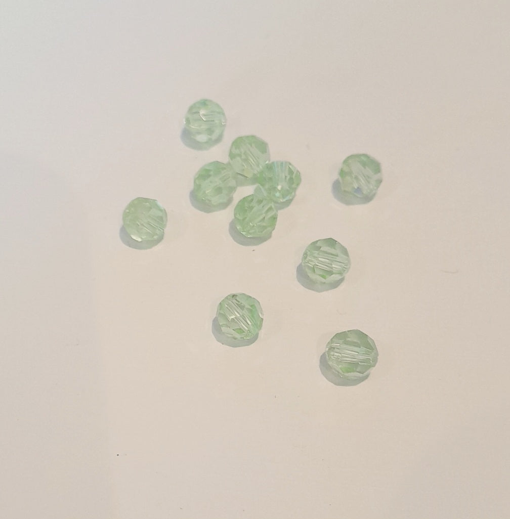 Ten small, faceted light green glass beads 6mm swarovski