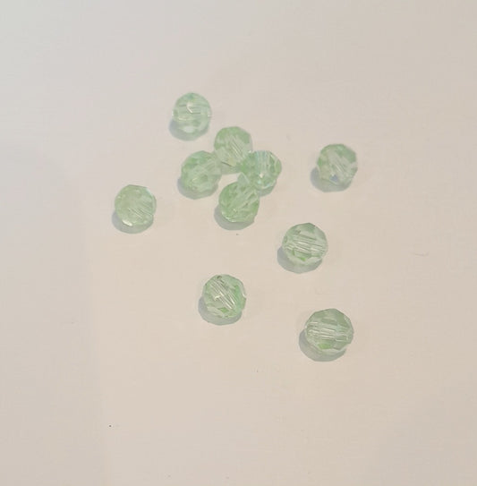 Ten small, faceted light green glass beads 6mm swarovski