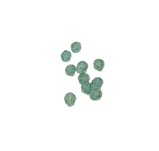 swarovski 6mm small faceted beads in a translucent mint green erinite color, 