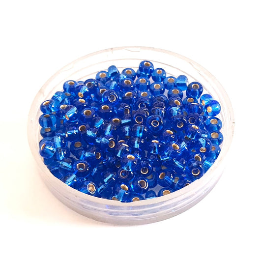 5 0 4.5mm Blue - Sapphire Silver Lined Czech Seed Bead