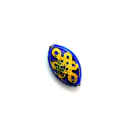 A blue oval-shaped metal bead with a geometric design, featuring gold-colored cloisonne wire accents on a flat surface.
