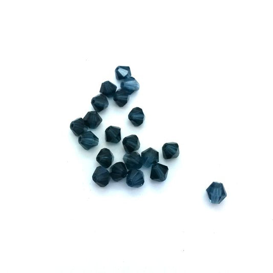 machine cut Czech Preciosa crystal bicone beads in transparent blue color.